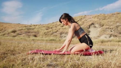 Woman Exercises Bridge Back Sports In A Countryside In Summer For Posture