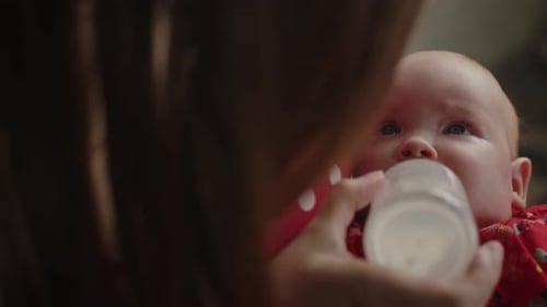 Close up of Baby Being Bottle Fed