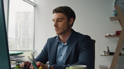 Handsome Businessman Typing Computer Working in Contemporary Office Closeup