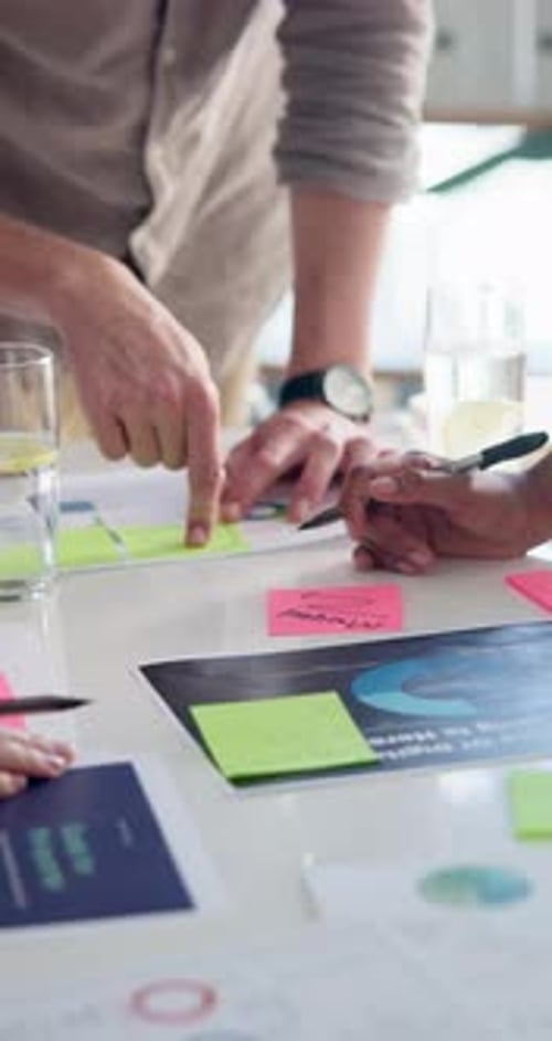 Team Collaborating on Strategy and Brainstorming at Table