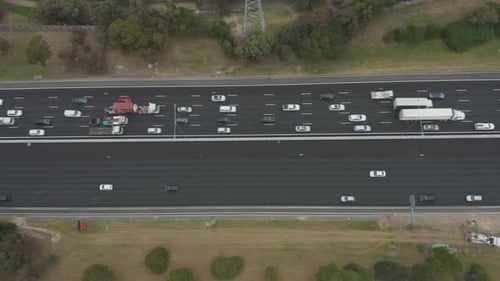Aerial perspective looking directly down on typical Australian highway. One lane busy and slow, the