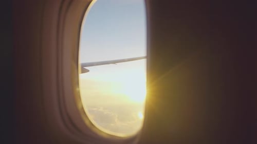 View of beautiful blue sky and sunset with cloudy outside an airplane.