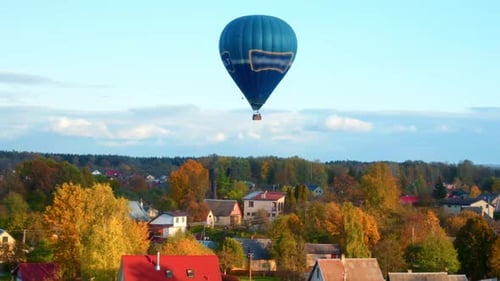 Stunning View Of Vibrant Autumn Colors In Vilnius City With Flying Hot Air Balloon. Aerial Shot