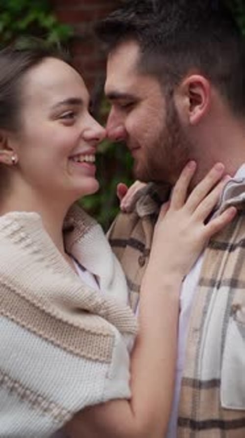 Happy Couple Smiling at Each Other Outside