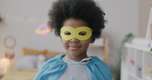 Cute Child Smiles Wearing Homemade Superhero Costume