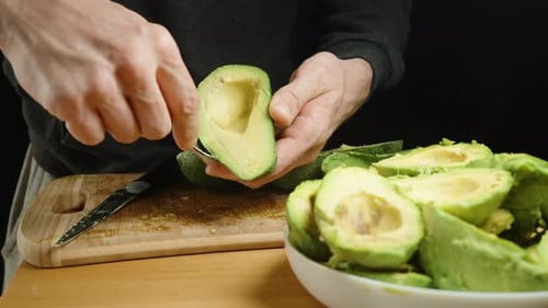 Scooping Fresh Avocado Flesh with Spoon