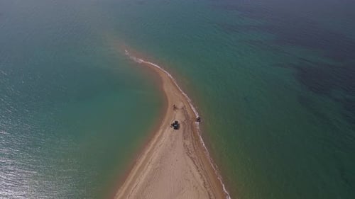 4k overhead steady clip over a peninsula on the tropical beach of Epanomi, Halkidiki, Greece