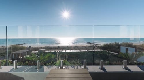 Aerial shot of the big villa's terrace with a view of the mediterranean sea and the beach in Frontig