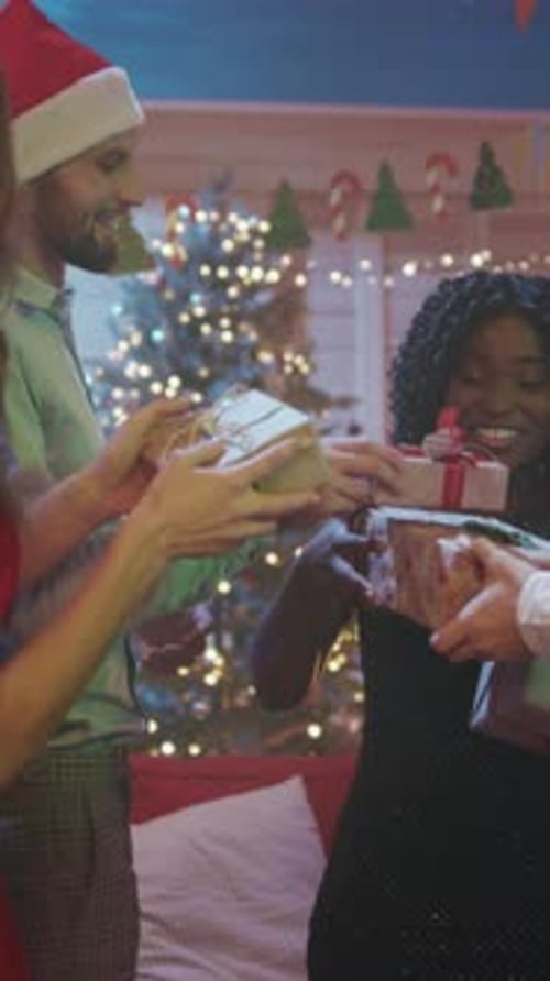 Friends Exchange Christmas Gifts at an Indoor Party