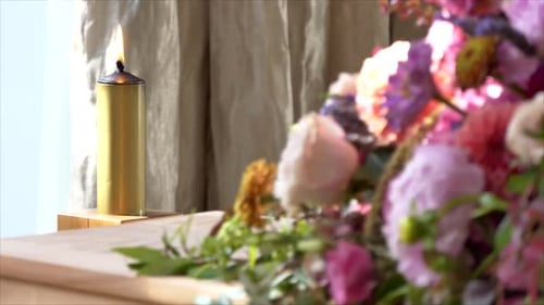 Shot of lighted candles used for prayers in memorial wedding funeral services in a religious church
