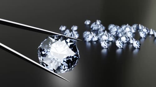 Close-Up of a Diamond Held by Tweezers