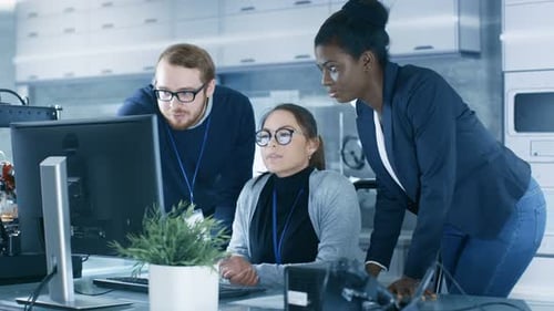 Diverse Team of Research Engineers Working in a high Tech Laboratory on a High Profile Start-up.