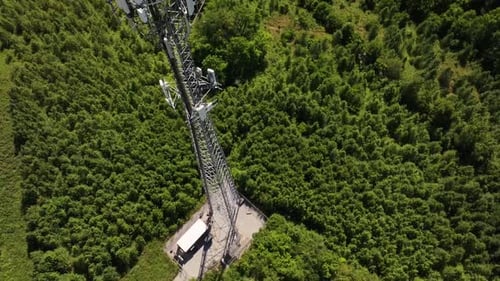 Aerial view of cell tower amidst greenery, United States.