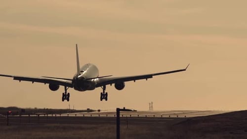 Jet airliner landing on runway.