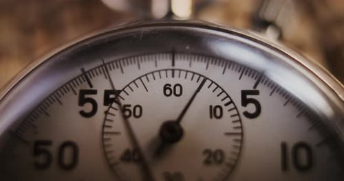 Time Lapse Macro Close Up Shot of Mechanical Stopwatch with Metallic Case and Dial