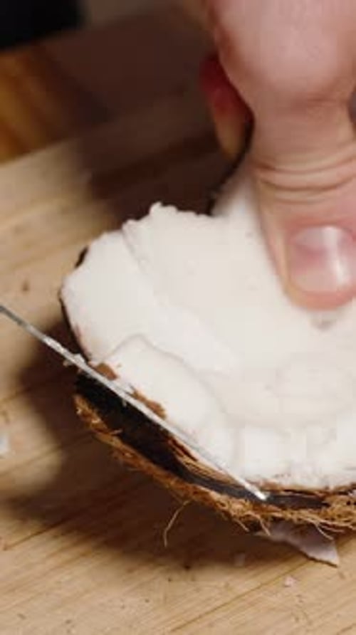 Removing Coconut Flesh from Shell with Knife