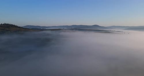 Misty Mountains Under a Sunrise Aerial Shot