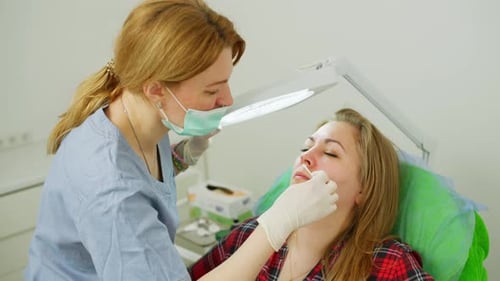 Woman Receives Cosmetic Treatment at a Medical Spa