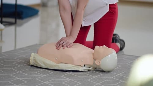 Practicing CPR on a Medical Training Dummy