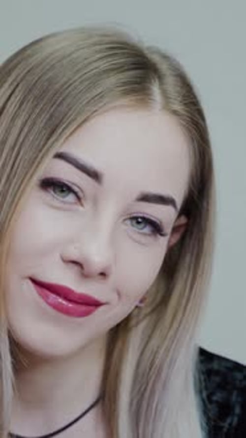 Young Woman Smiling in Close-up Shot