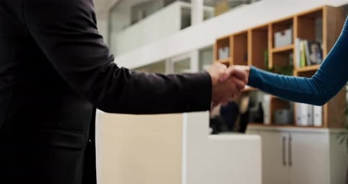 Hotel, reception and people with handshake for welcome, introduction or help for accommodation