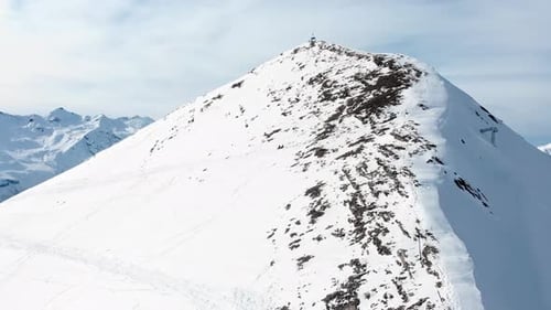 To Skiers Rest On Mountain Peak