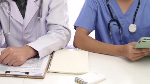 Medical Professionals in Discussion at Hospital Workplace