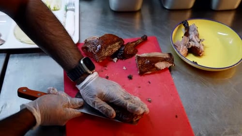 Black Man Chef Cooking in Professional Kitchen of Restaurant Closeup View of Hands and Table