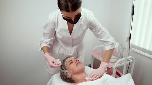 Therapy for Rejuvenating Mature Skin in Cosmetology Clinic Enhancing Glow Specialist Carefully