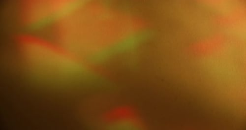 Abstract golden background with lighting effects and flares