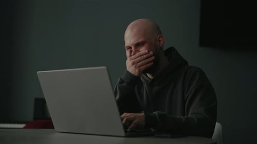 Cheerful Freelancer Male Laughing Heartily While Working From Home Enjoying Moment of Joy Using