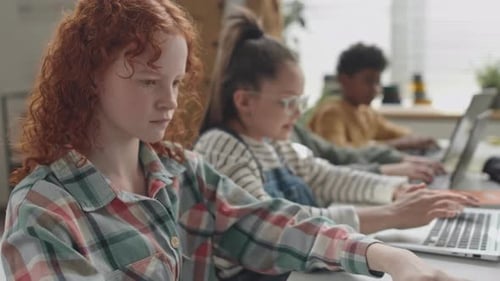 School Girl Using Laptop during Computer Class