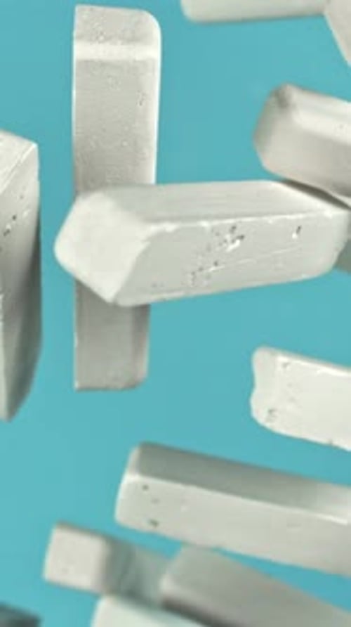 School Chalk Flying on a Blue Background Filmed on a Highspeed Camera at 1000 Fps