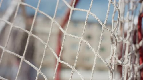 Closeup of Net Outdoor Sports Scene with Textured Net and Dramatic Background Detailed View of Net