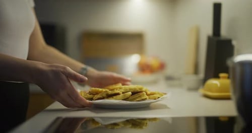 Plate of Fried Fritters on Kitchen Counter