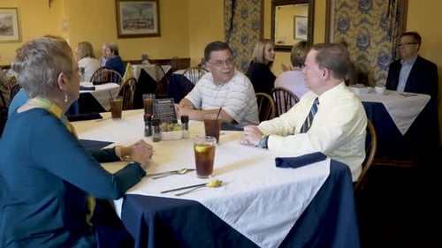 Closeup shot of business people talking while waiting for their food to be delivered at a restaurant