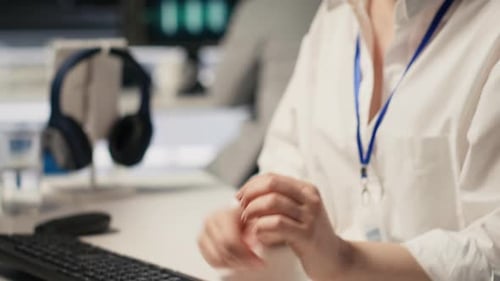 Software Developer Monitoring Server Clusters Performing AI Training Close Up