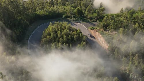 U Form Mountain Road And Car Passing By Aerial Shot