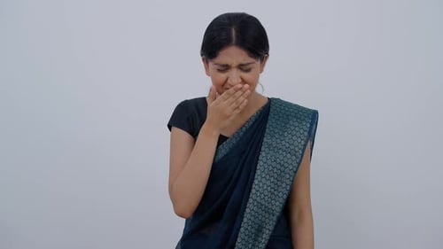 Woman reacting to unpleasant taste or smell
