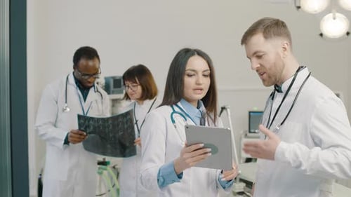 Medical Team Discussing Diagnosis in Hospital Setting