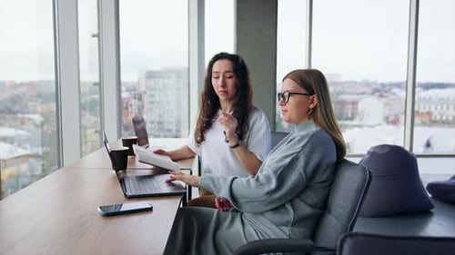 Women Working Together in Modern Office Space