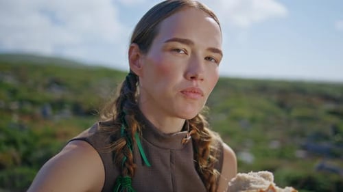 Woman Tasting Delicious Bread on Green Hill Closeup Countryside Girl Smell Loaf