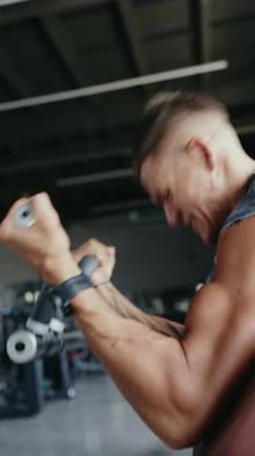 Intense Workout Session With Determined Young Man Exercising In Gym