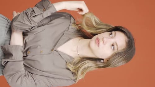 Young Woman posing and playing with her hair