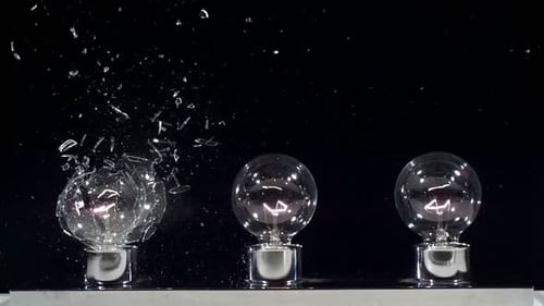 Light Bulb Exploding in Slow Motion on Black Background