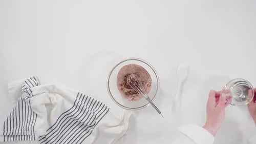 Cinnamon Rolls Being Prepared Overhead