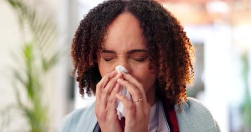 Woman Blowing Nose with Tissue Close Up