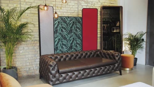 A Stylish Modern Lounge Featuring Chic and Elegant Furniture Alongside Lush Greenery