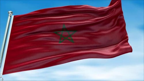 Morocco Flag Moving in the Wind Against the Blue Sky
