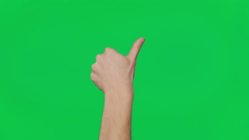 Man's Hand Shows Gestures and Signs of Success on a Chroma Key Green Screen Background Thumb Up
